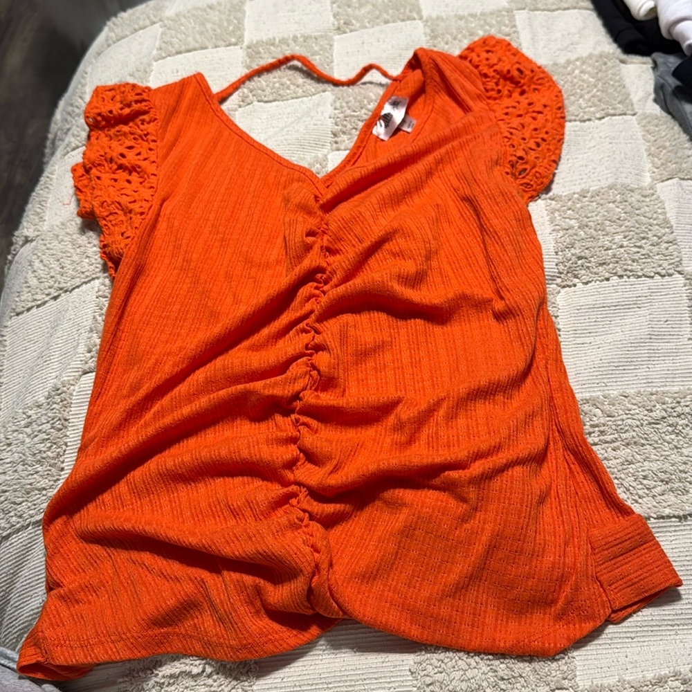 Rouche top and it has a tie in back of shirt